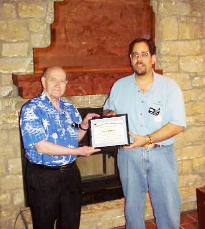 Dick Emmons receives award in 2002, from the Wilderness Center Astronomy Club, recognition of exceptional achievement in amateur astronomy and astronomy education.